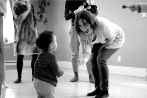 Lenni with 15-mos-old student C., doing the shaker dance