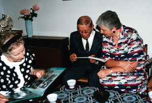 Dorothy Jones showing Dr. and Mrs. Suzuki pictures of Suzuki ECE classes -photo taken during the 1989 Suzuki Method World Convention in Matsumoto Japan.